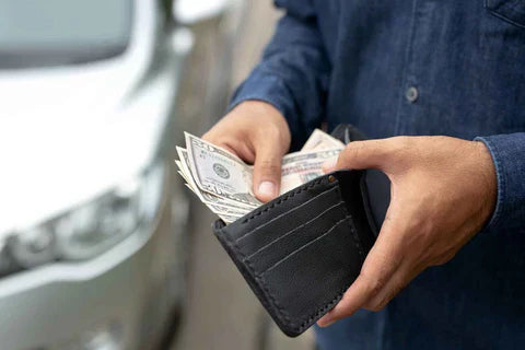 Holding wallet counting paper cash